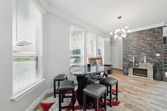 a dining room with furniture and window