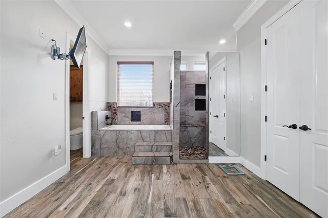 a bathroom with a sink mirror and shower