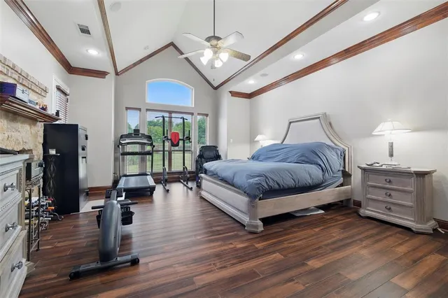 a bedroom with furniture and a chandelier