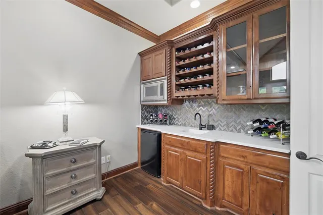 a kitchen with cabinets and window