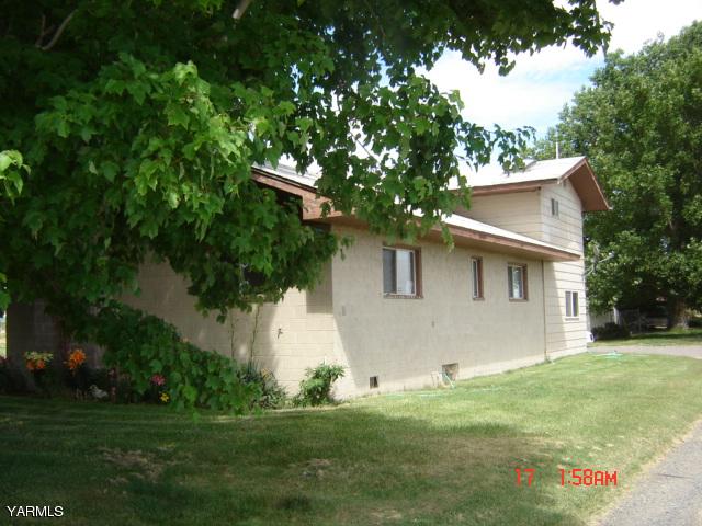 5711 Lateral A Road Wapato, WA 98951 - Photo 2 of 16 a house that has a tree in front of it