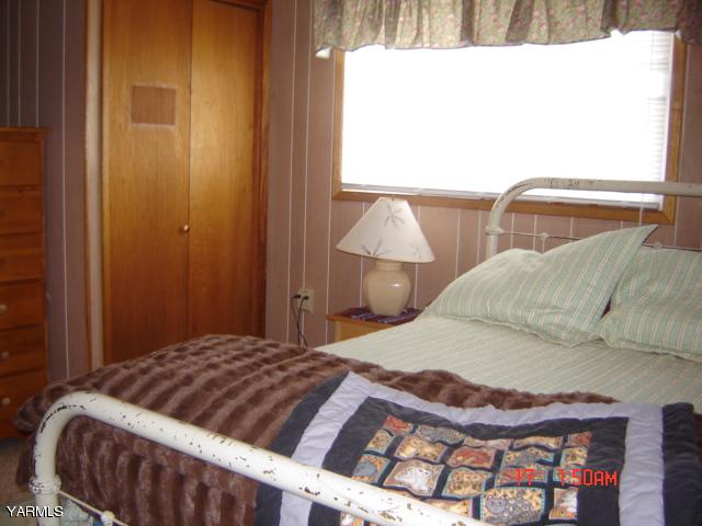 5711 Lateral A Road Wapato, WA 98951 - Photo 13 of 16 a bedroom with a bed and lamp