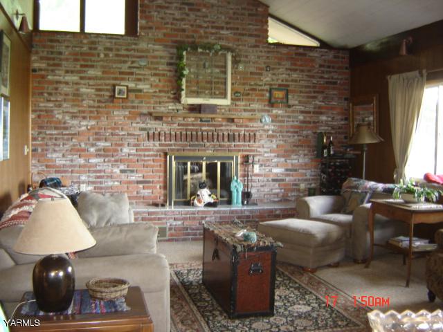 5711 Lateral A Road Wapato, WA 98951 - Photo 4 of 16 a living room with furniture and a fireplace