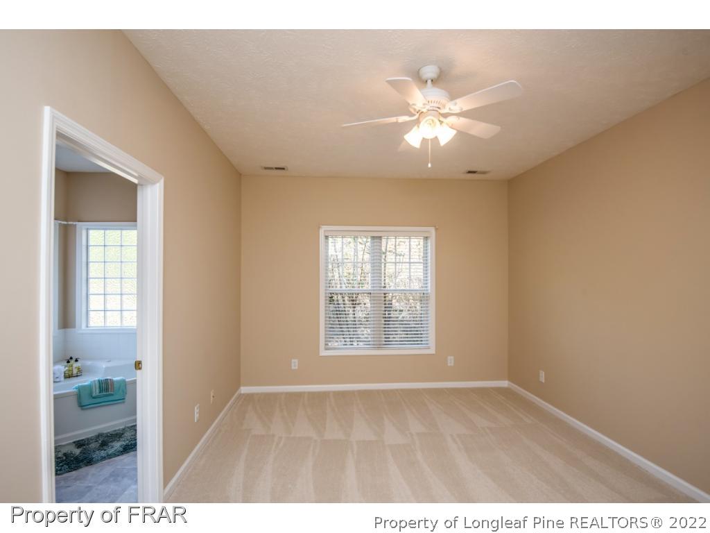 3050 McDuffies Mill Road, Unit 7 Fayetteville, NC 28311 - Photo 14 of 22 a view of an empty room with window and cabinet