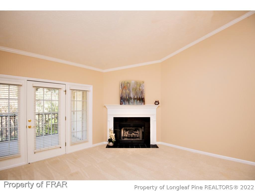 3050 McDuffies Mill Road, Unit 7 Fayetteville, NC 28311 - Photo 4 of 22 a view of an empty room with a fireplace