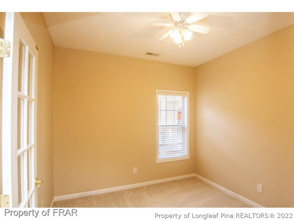 3050 McDuffies Mill Road, Unit 7 Fayetteville, NC 28311 - Photo 7 of 22 a view of a big room with windows and chandelier fan