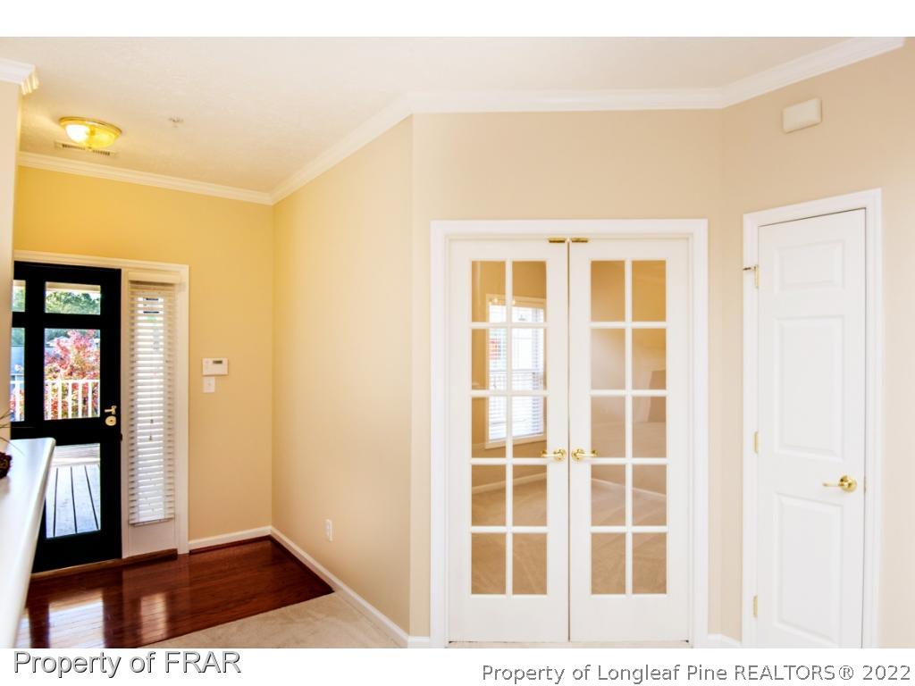3050 McDuffies Mill Road, Unit 7 Fayetteville, NC 28311 - Photo 10 of 22 view of a bedroom with wooden floor and windows