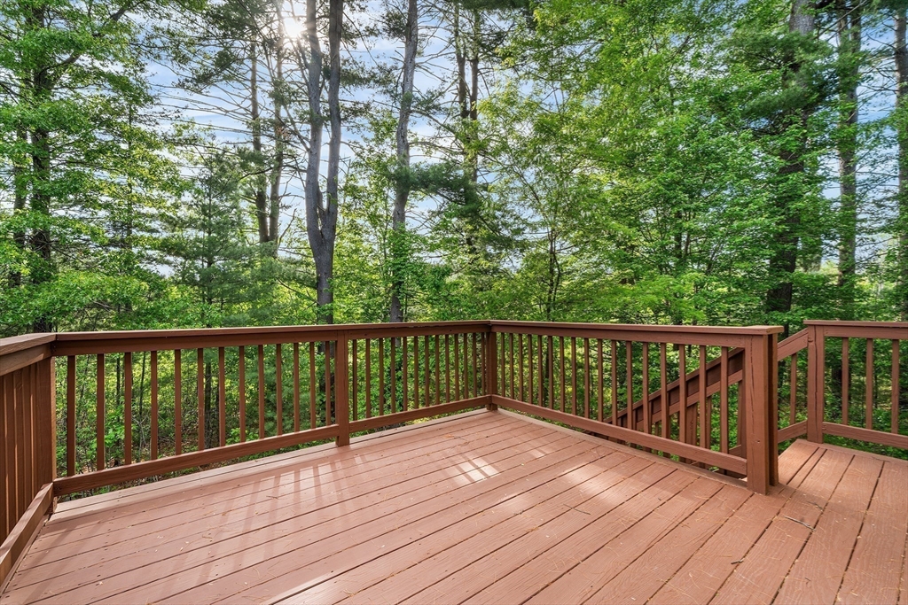 215 Rangeway Road, Unit 31 Billerica, MA 01862 - Photo 33 of 40 a view of balcony with wooden floor and fence