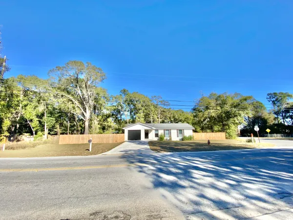 a view of a road with a building in the background