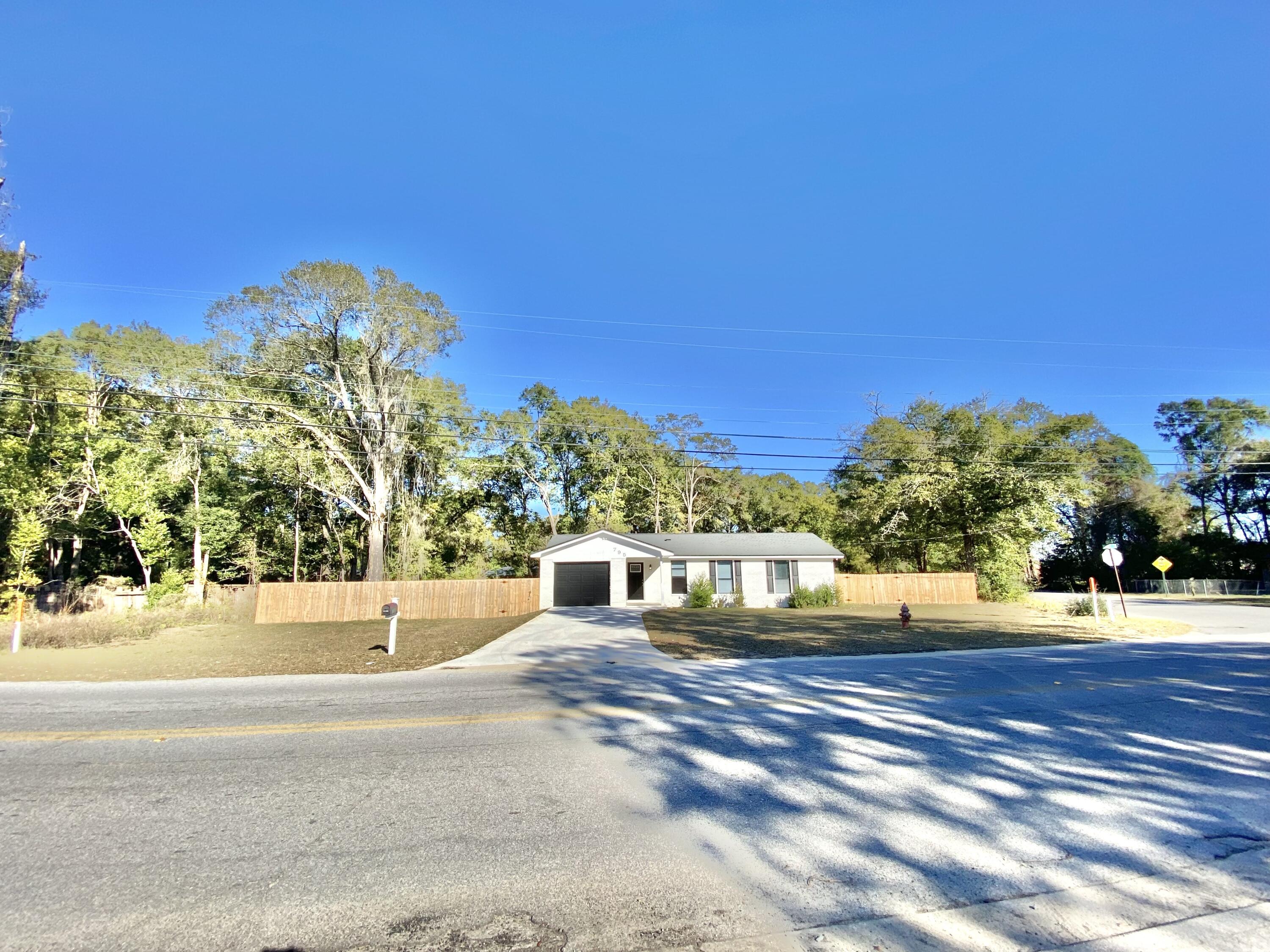 a view of a road with a building in the background