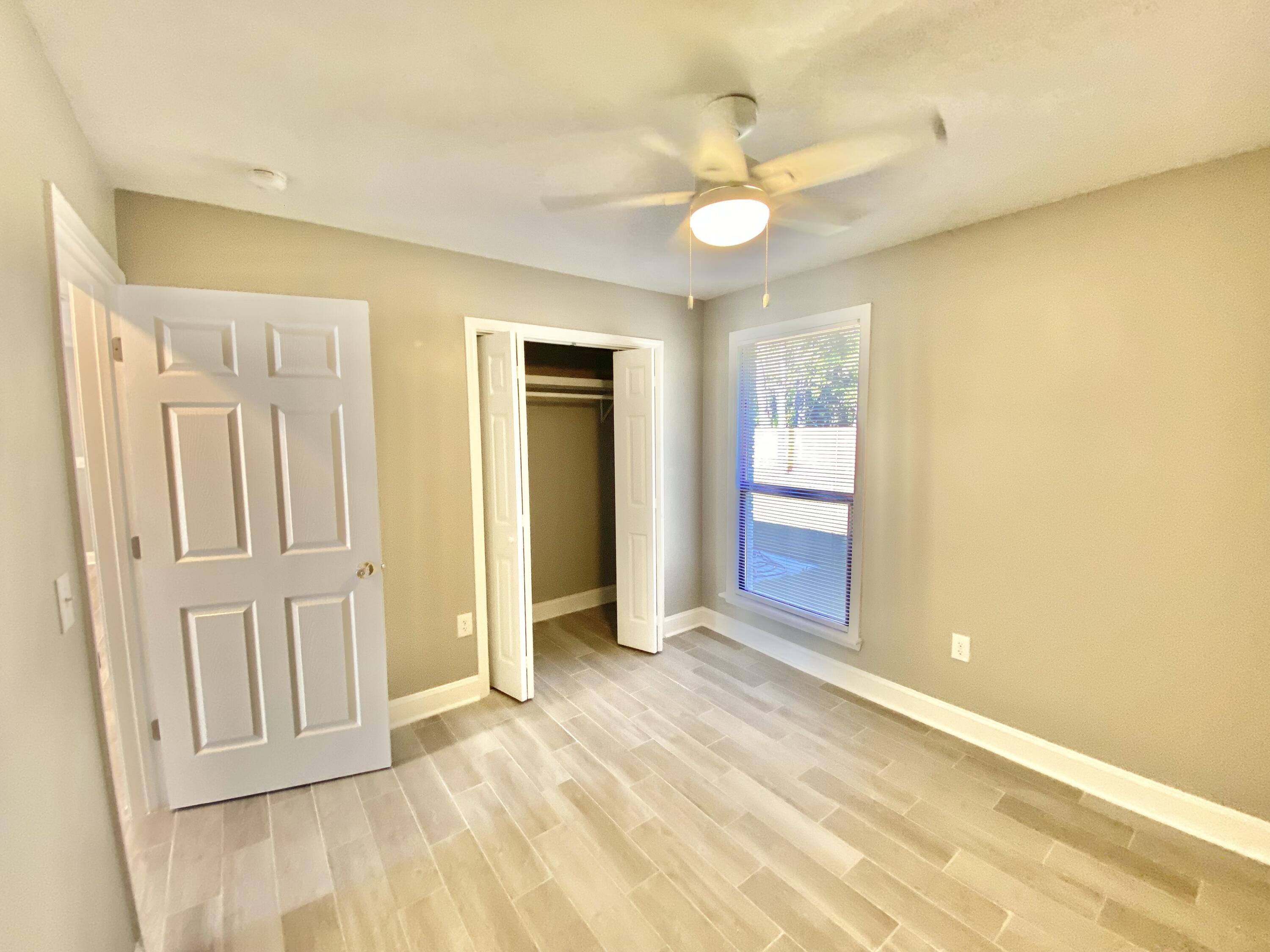 795 Bay Street Crestview, FL 32536 - Photo 15 of 34 an empty room with a natural light
