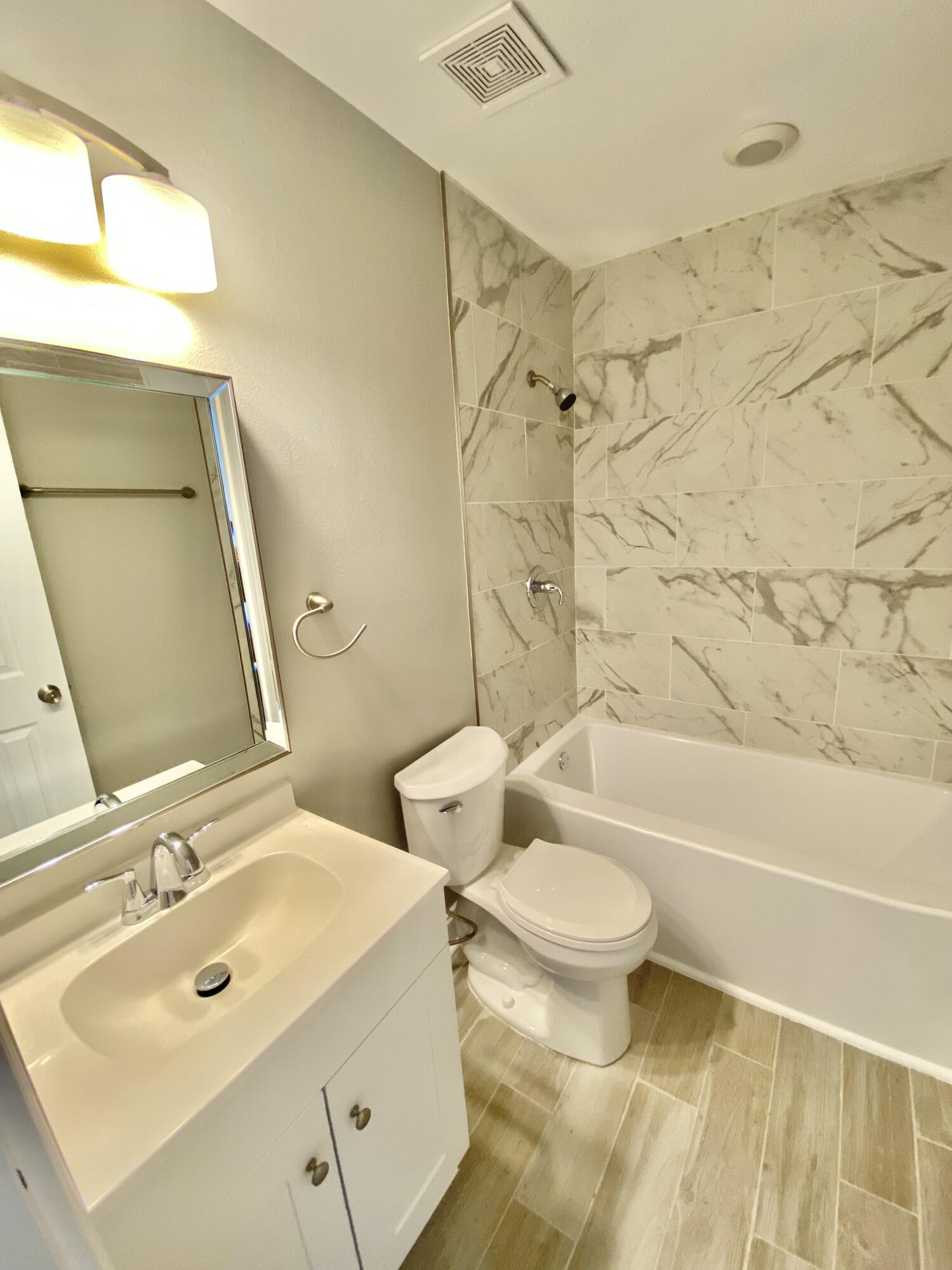 795 Bay Street Crestview, FL 32536 - Photo 16 of 34 a bathroom with a sink toilet and shower