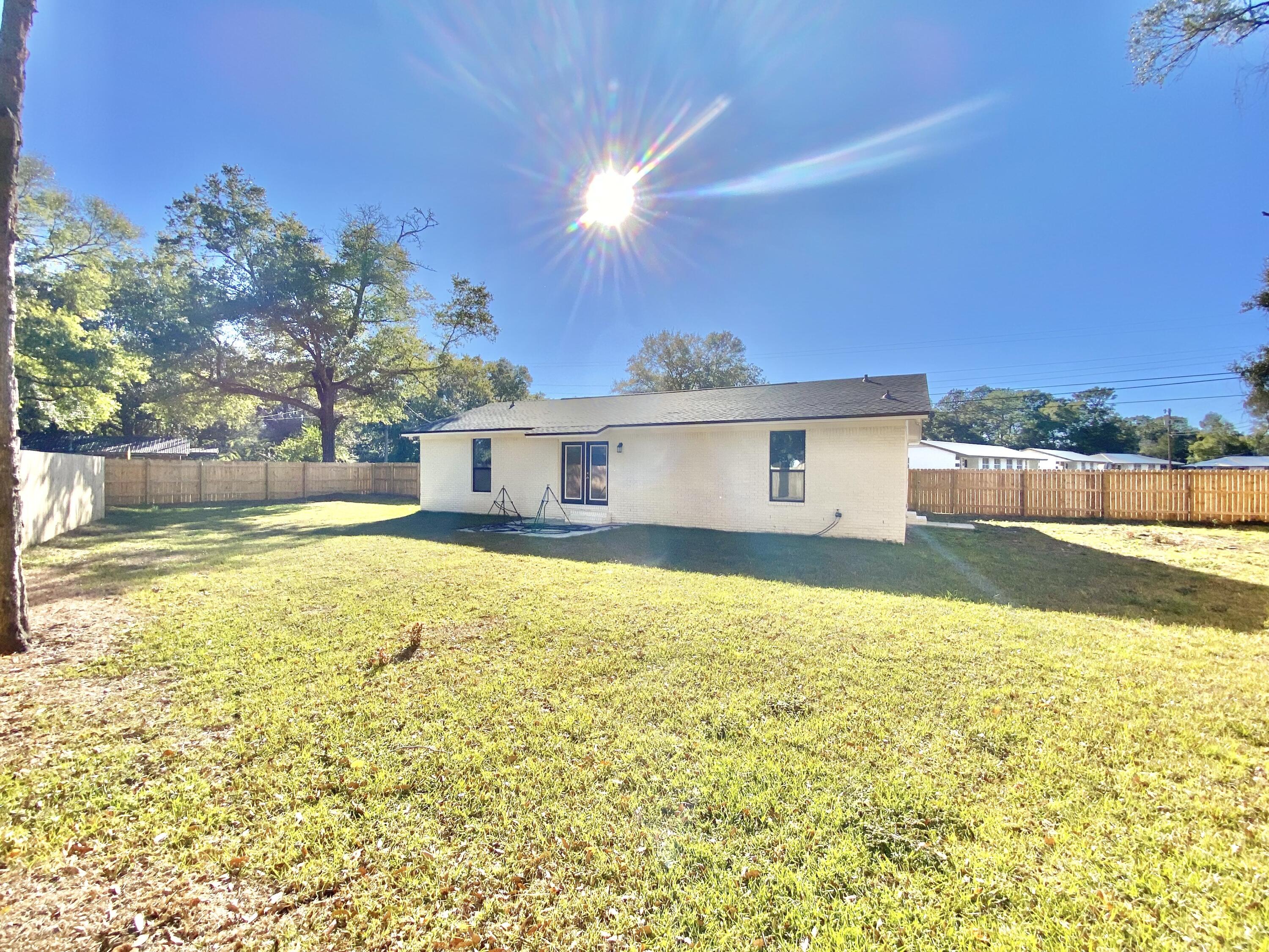 795 Bay Street Crestview, FL 32536 - Photo 32 of 34 a house view with swimming pool in front of it