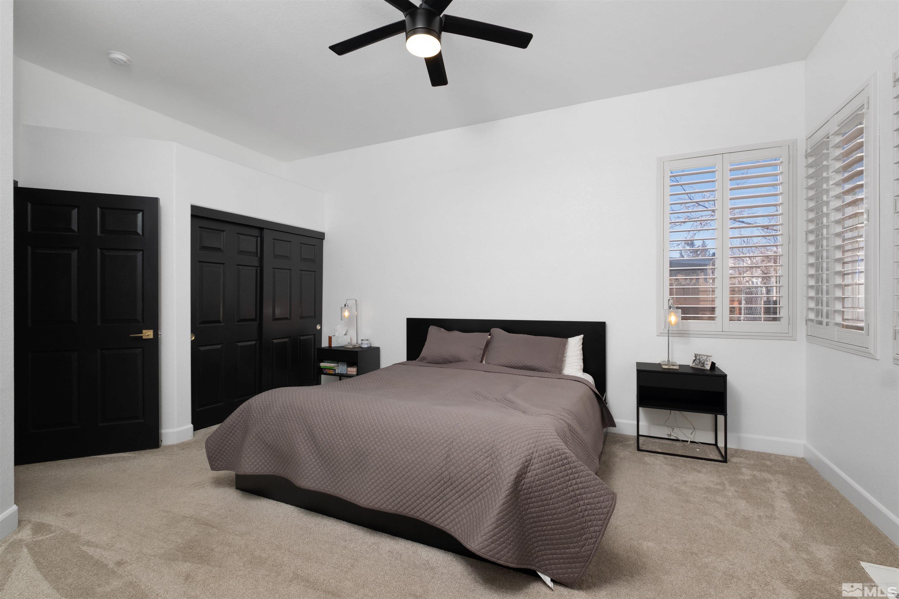 1651 Box Canyon Drive Reno, NV 89521 - Photo 11 of 40 a bedroom with a bed and a chair