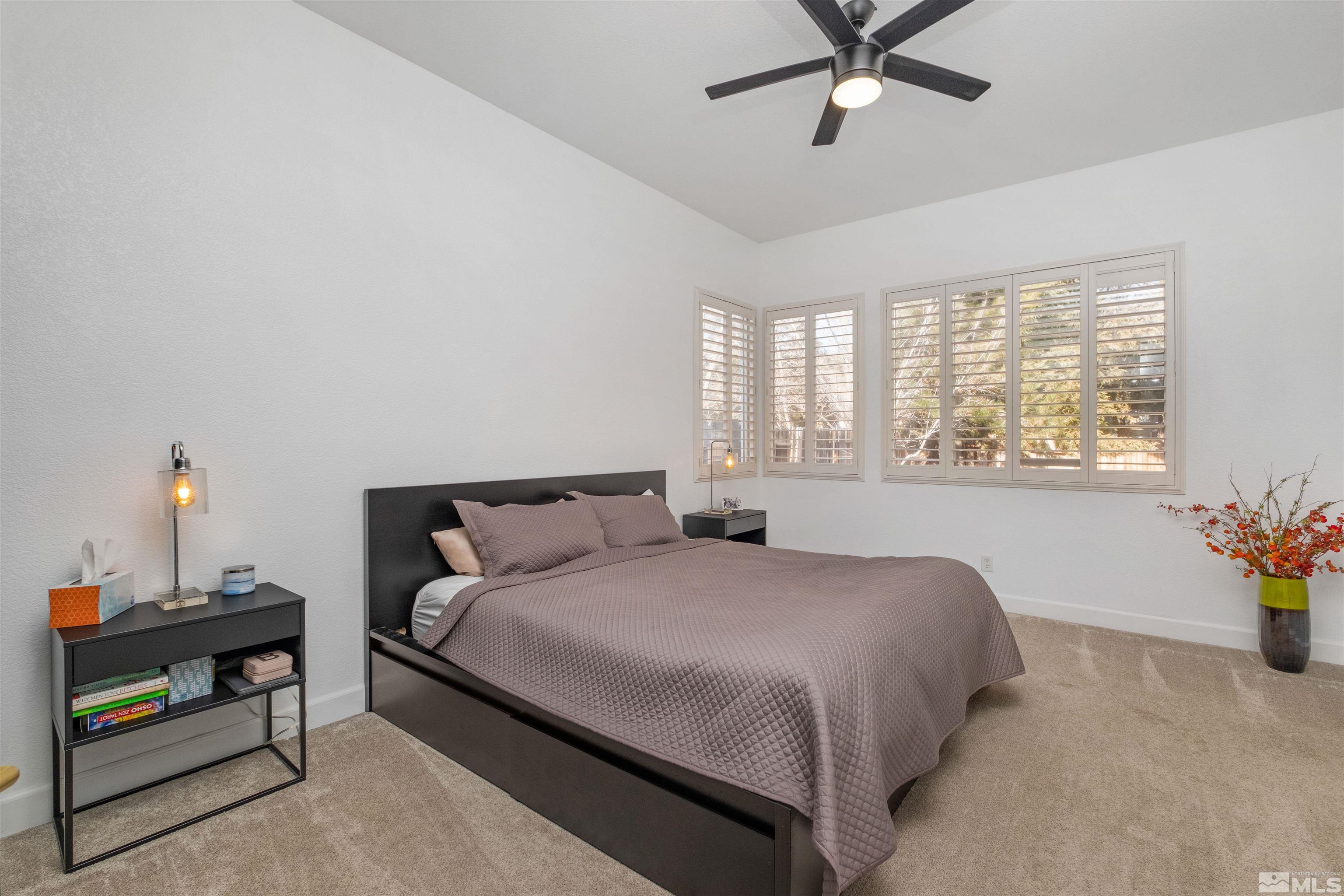 1651 Box Canyon Drive Reno, NV 89521 - Photo 12 of 40 a bedroom with a bed and window
