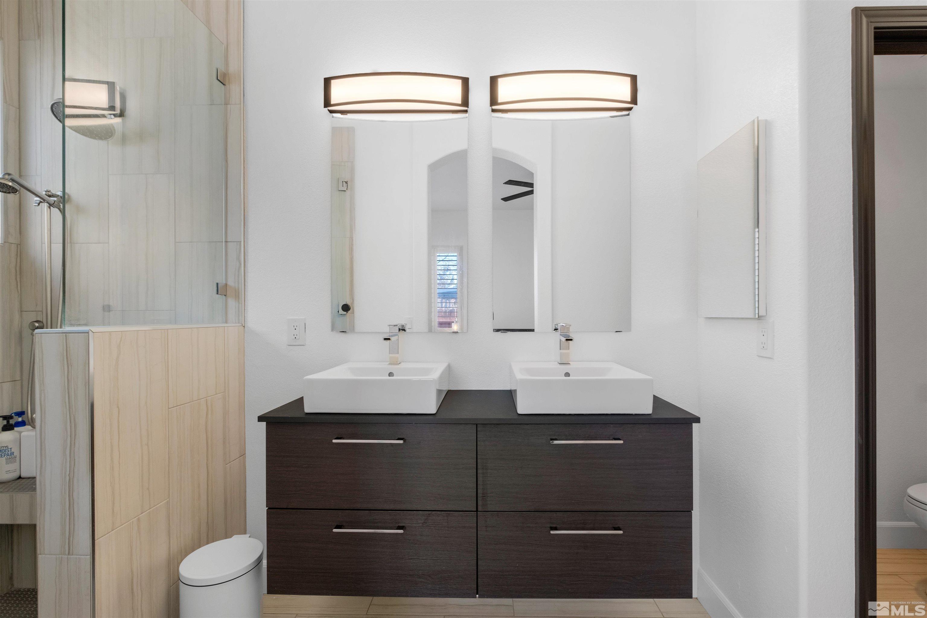 1651 Box Canyon Drive Reno, NV 89521 - Photo 15 of 40 a bathroom with a sink and a mirror