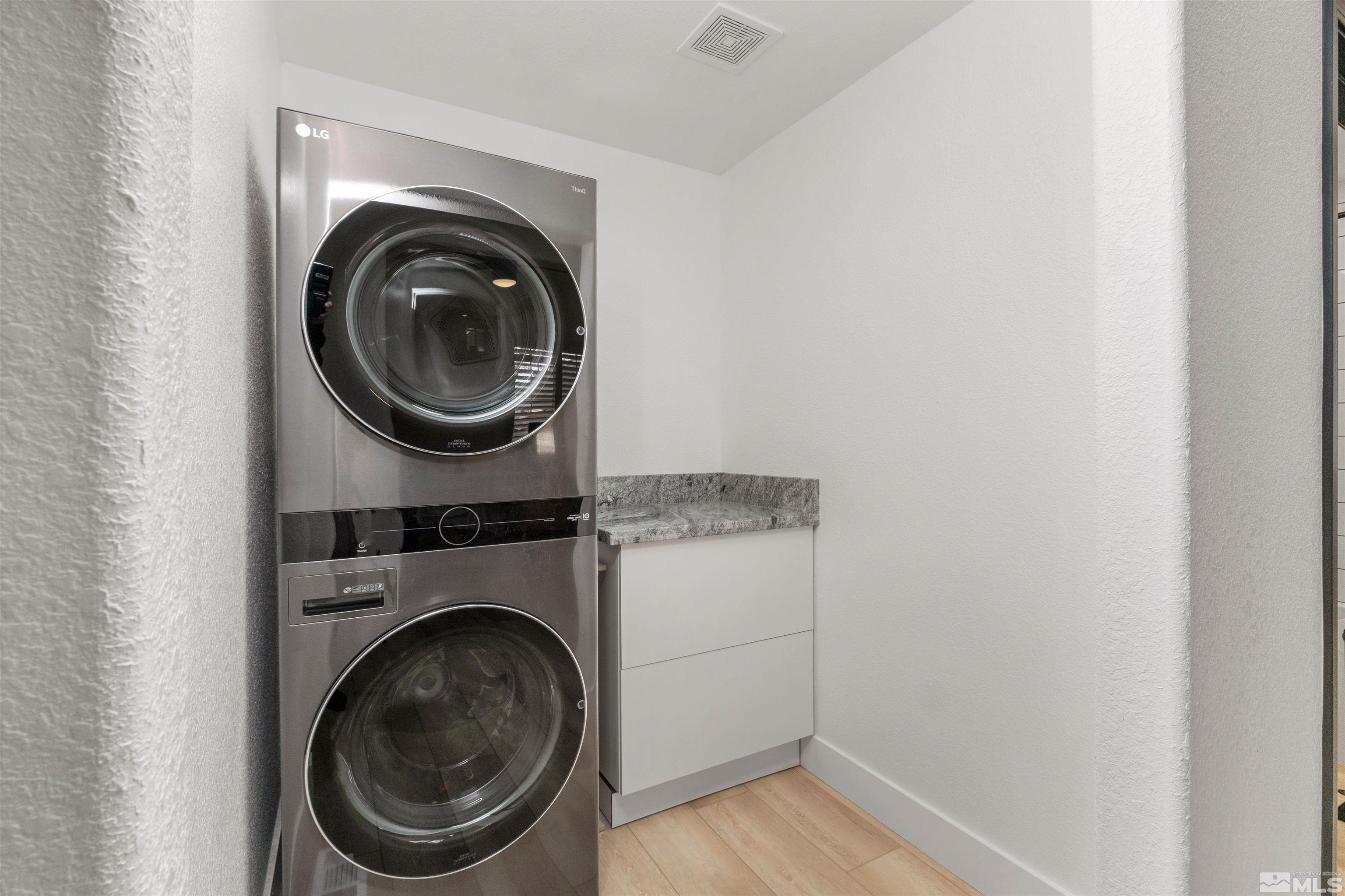 1651 Box Canyon Drive Reno, NV 89521 - Photo 18 of 40 a utility room with dryer and washer