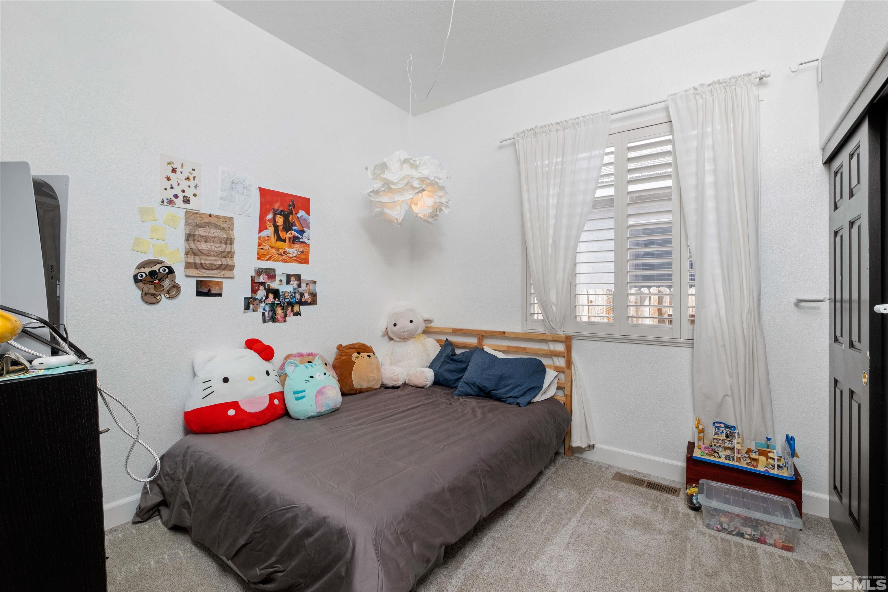 1651 Box Canyon Drive Reno, NV 89521 - Photo 19 of 40 a bedroom with a bed and a window
