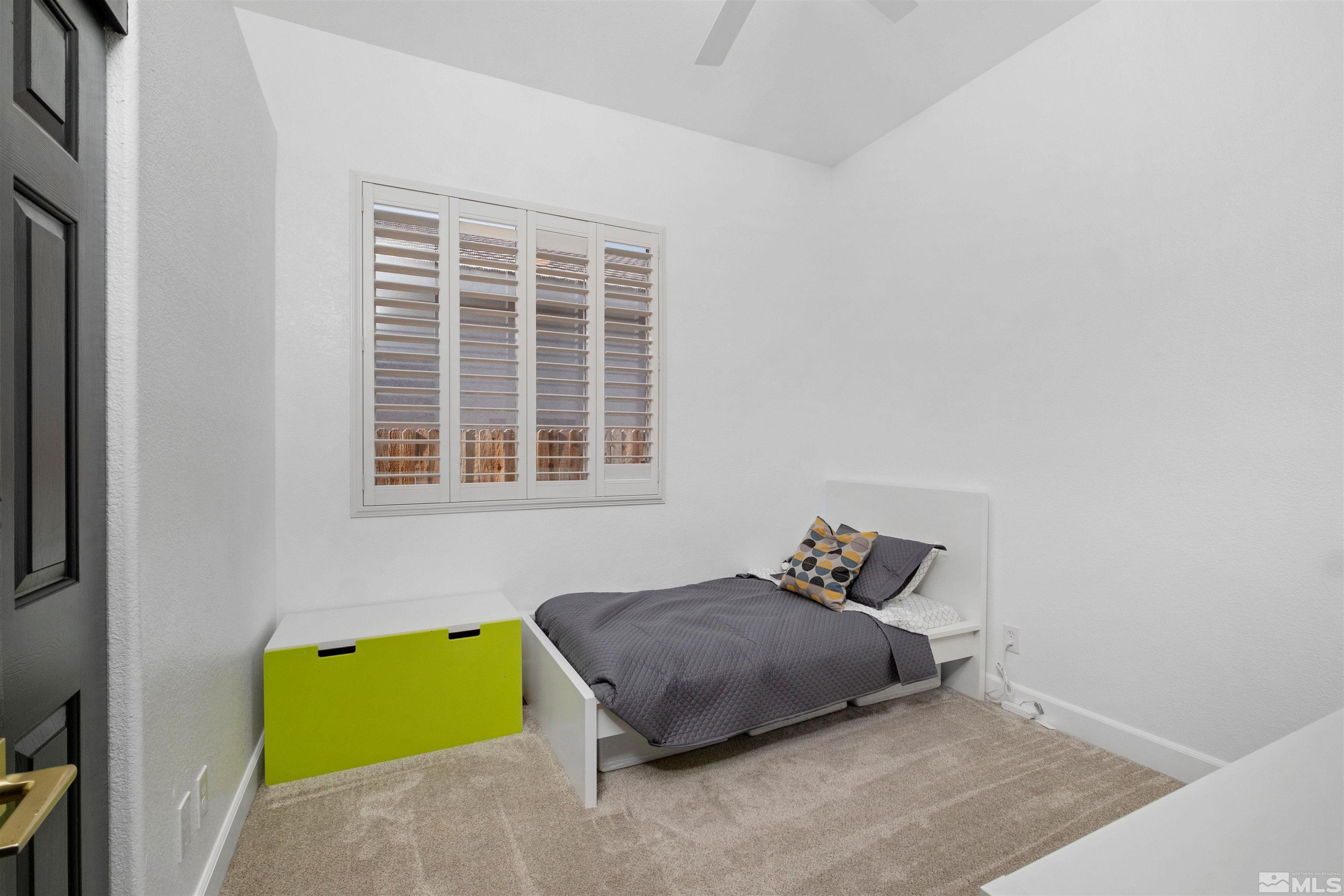 1651 Box Canyon Drive Reno, NV 89521 - Photo 20 of 40 a bedroom with a bed and a window