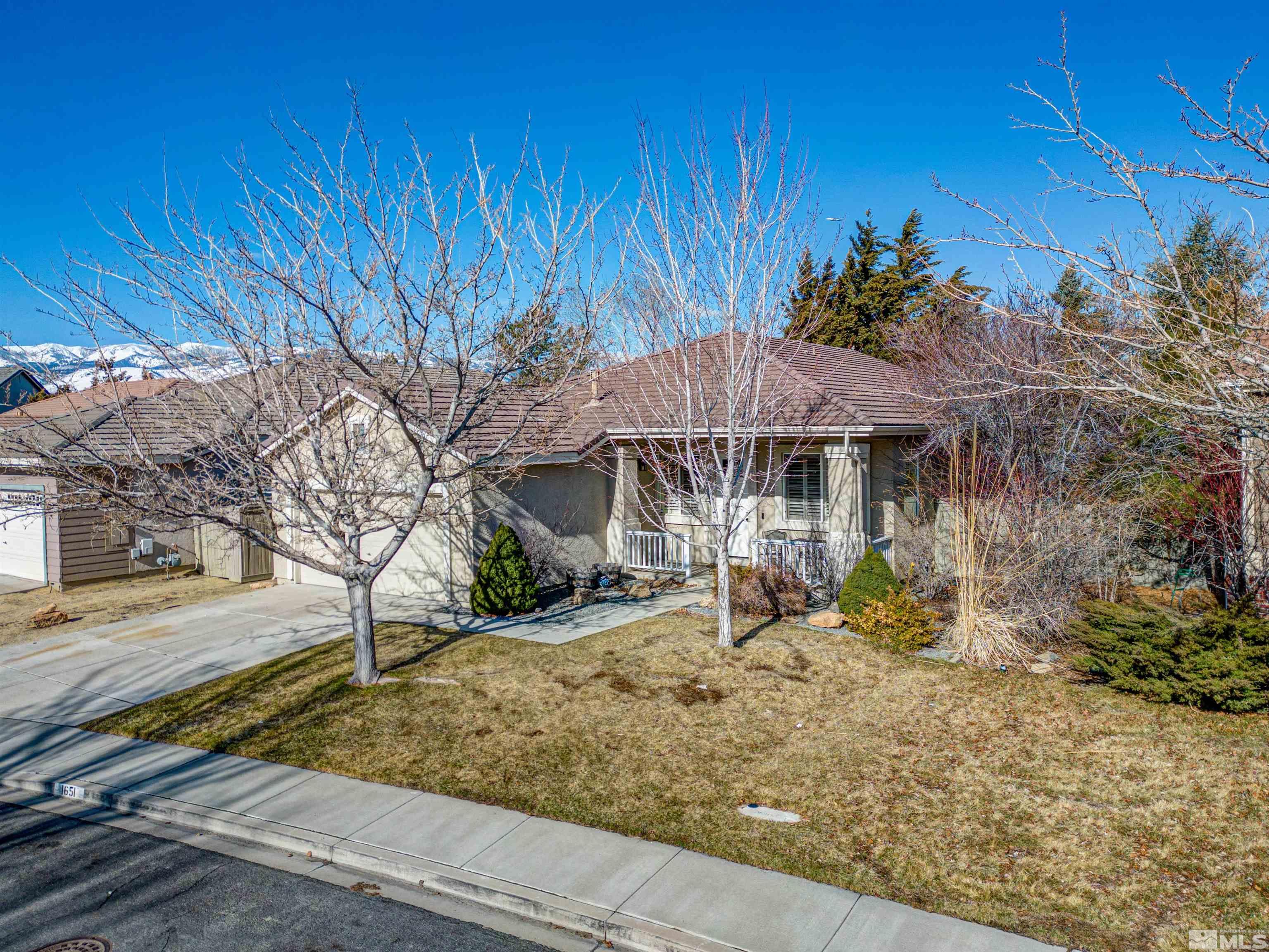 1651 Box Canyon Drive Reno, NV 89521 - Photo 2 of 40 a front view of a house with garden