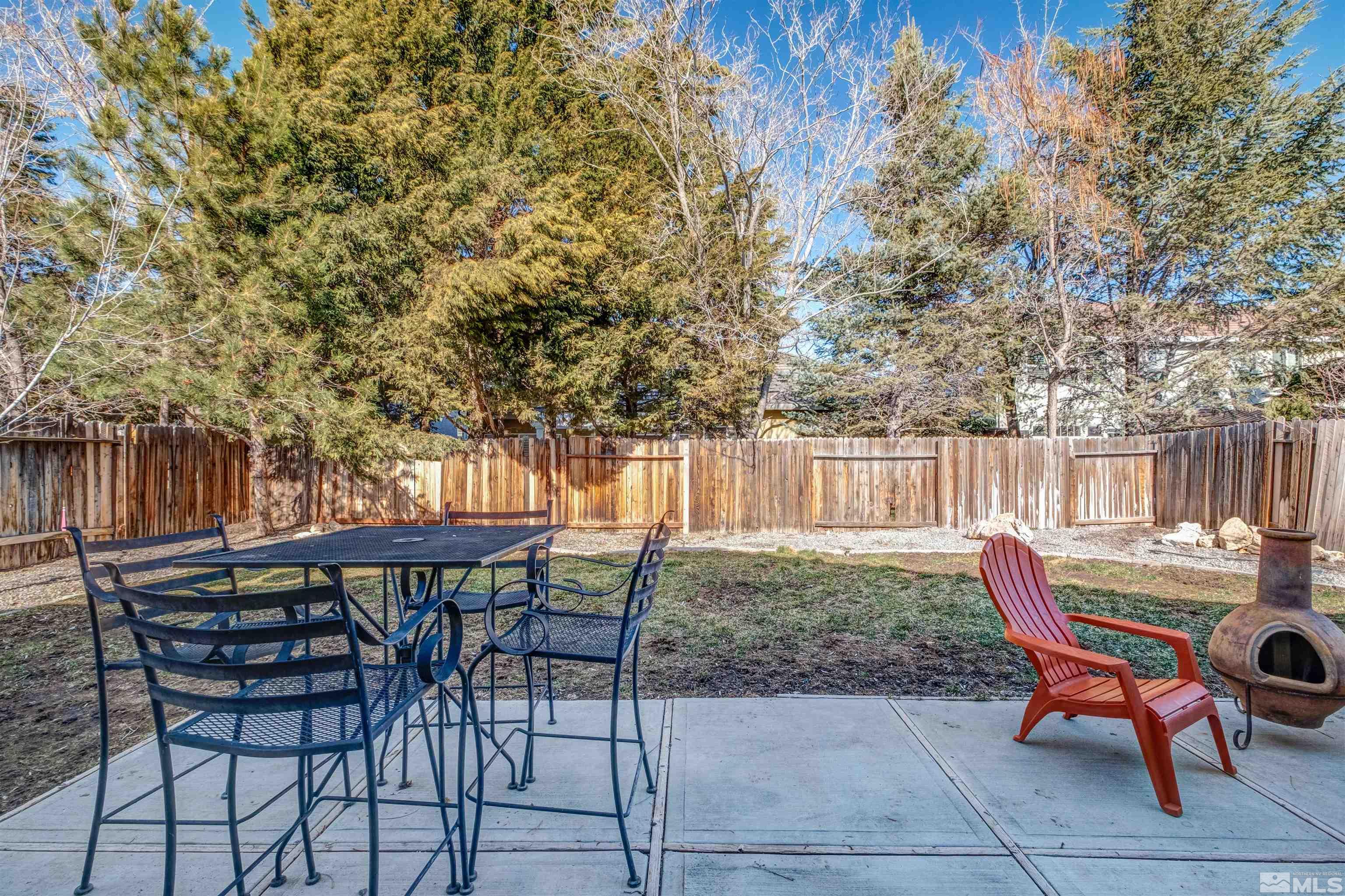 1651 Box Canyon Drive Reno, NV 89521 - Photo 23 of 40 a view of a chairs and table in backyard