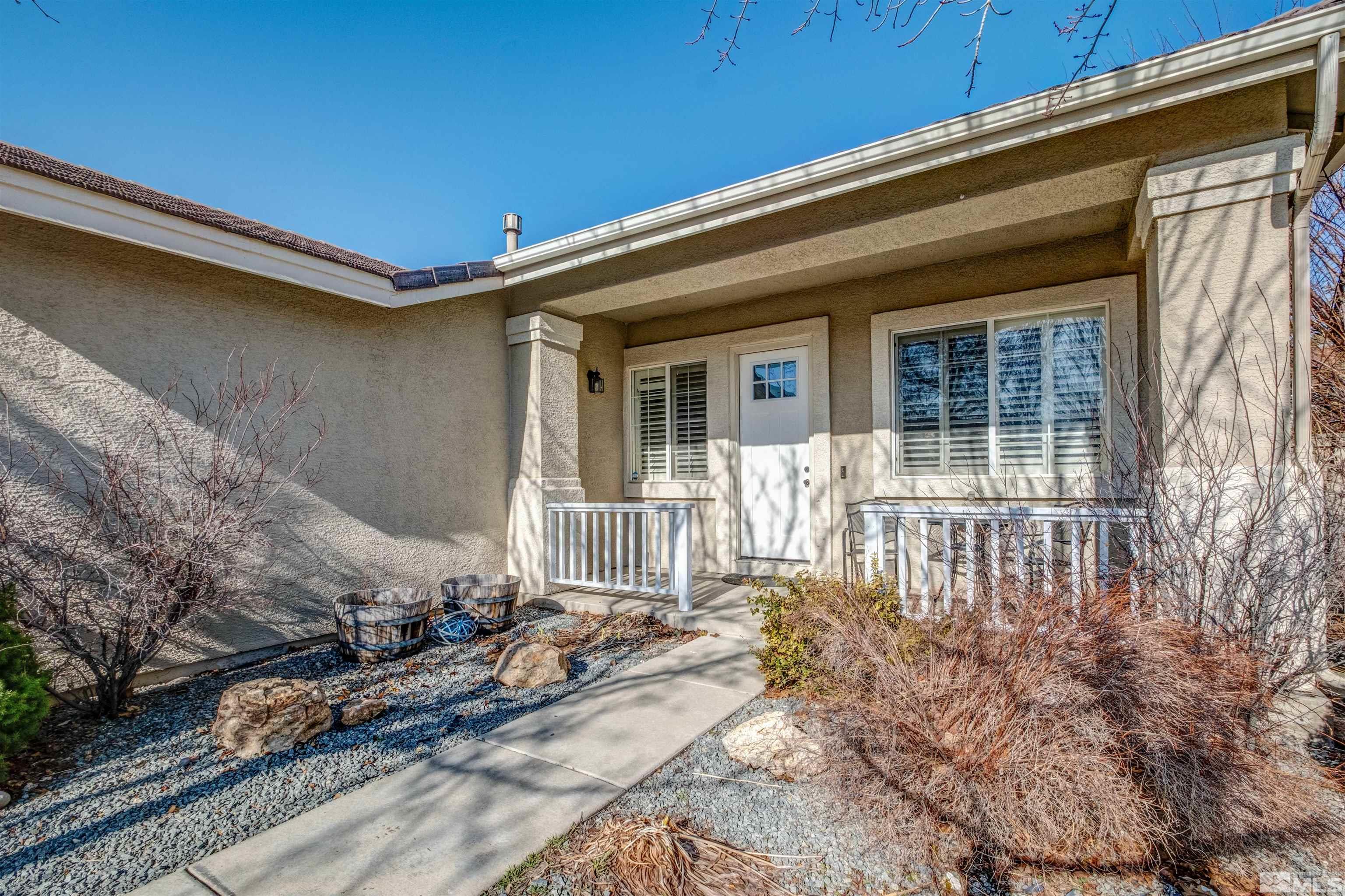1651 Box Canyon Drive Reno, NV 89521 - Photo 3 of 40 a front view of a house with a large window