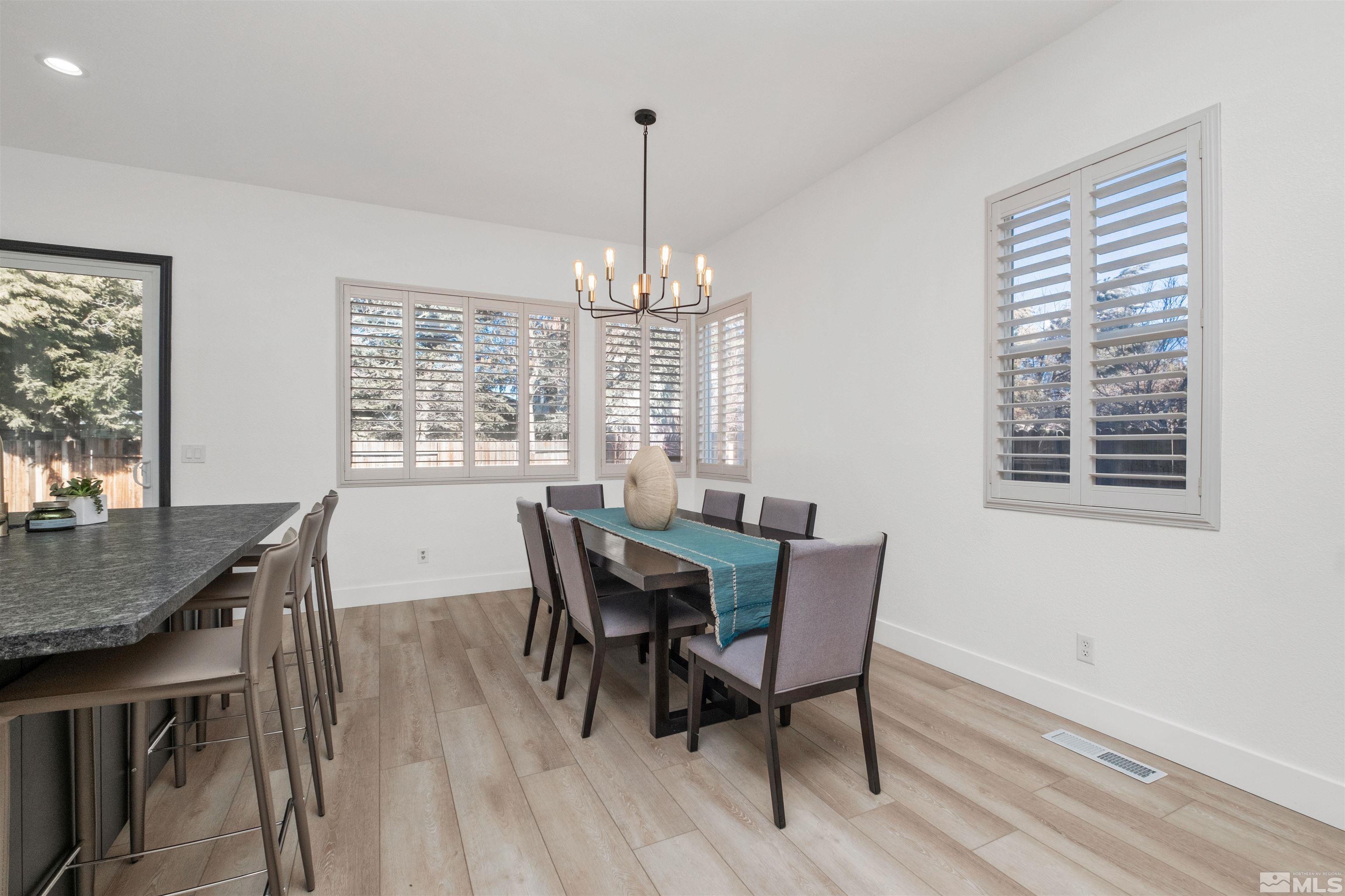 1651 Box Canyon Drive Reno, NV 89521 - Photo 7 of 40 a view of a dining room with furniture window and outside view