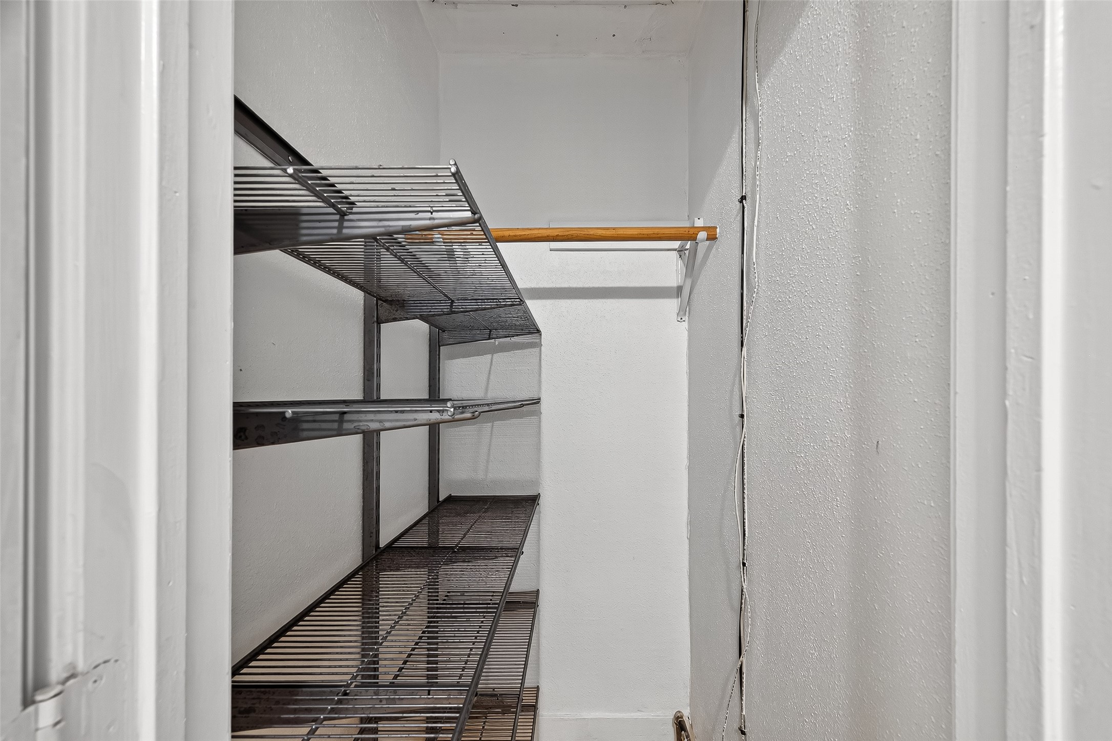 5122 Larkin Street Houston, TX 77007 - Photo 24 of 28 A walk-in closet at the end of the hallway offers superb shelving space. This one is not in either bedroom -- it's just a closet at the end of the hall.