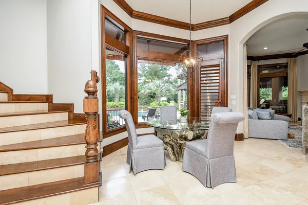 a living room with furniture large window and a fireplace