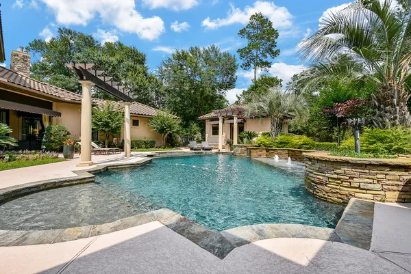 a patio with table and chairs