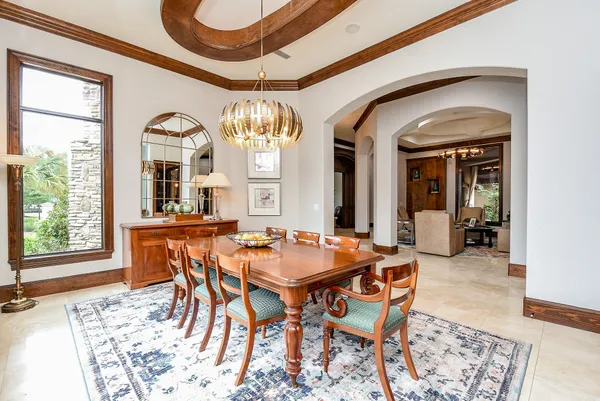 a kitchen with a lot of cabinets and a wooden floor