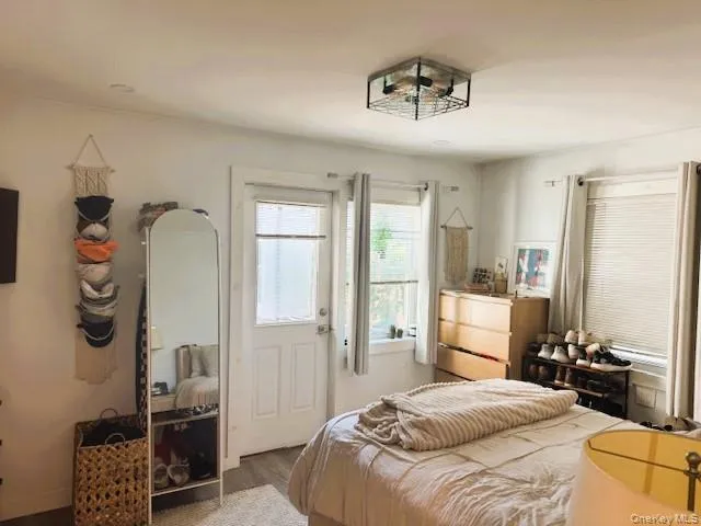 a bedroom with a bed and dresser