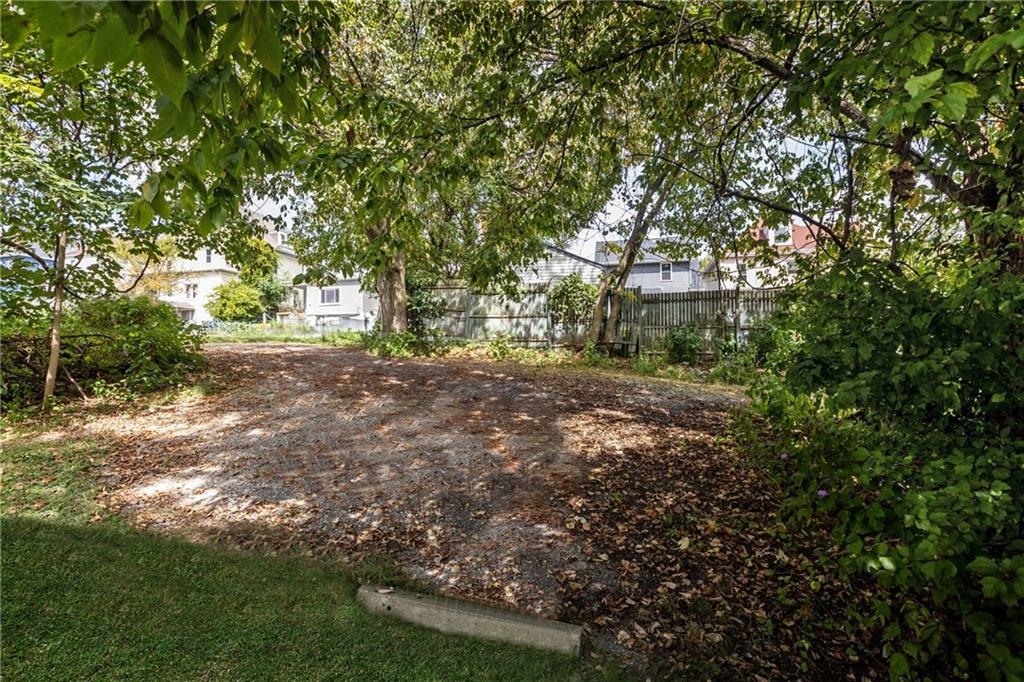 118 Oak Spring Road Canonsburg, PA 15317 - Photo 23 of 32 A large mature tree provides excellent shade and a natural focal point in the backyard. It creates a relaxing atmosphere, perfect for enjoying outdoor activities or unwinding on warm days.