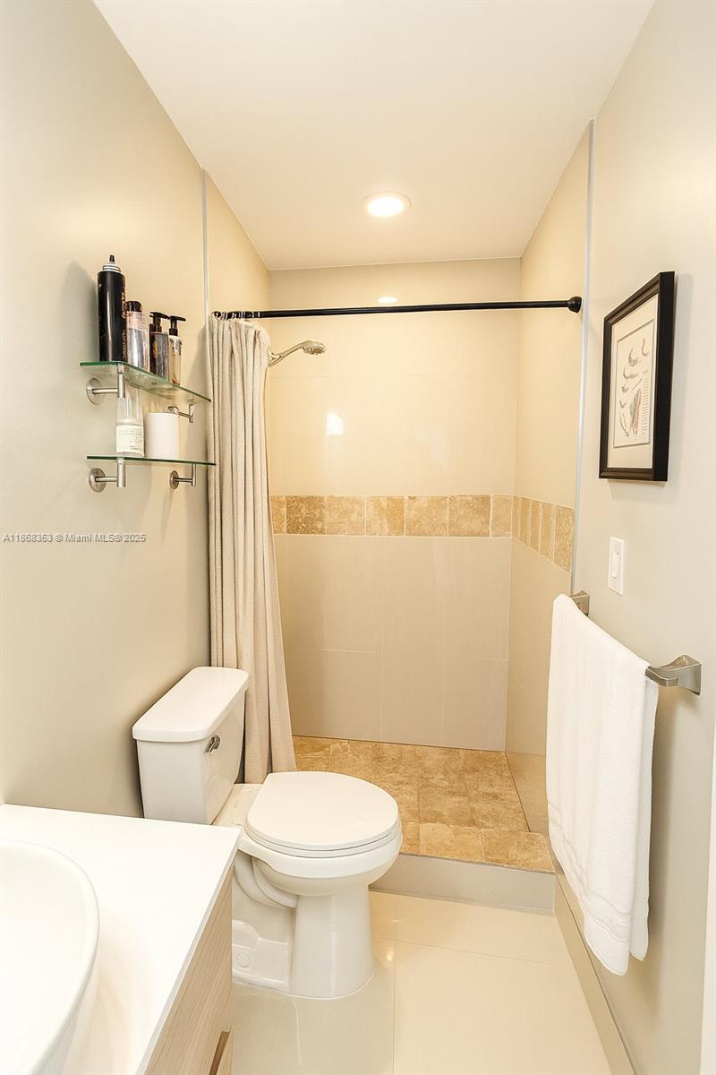 5250 Southwest 96th Avenue Miami, FL 33165 - Photo 15 of 16 a bathroom with a toilet and a shower