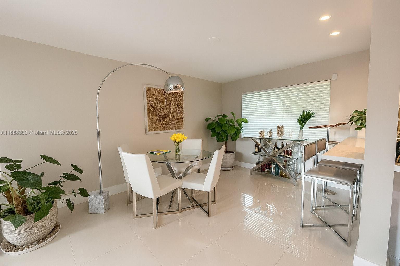 5250 Southwest 96th Avenue Miami, FL 33165 - Photo 9 of 16 a living room with furniture and a potted plant