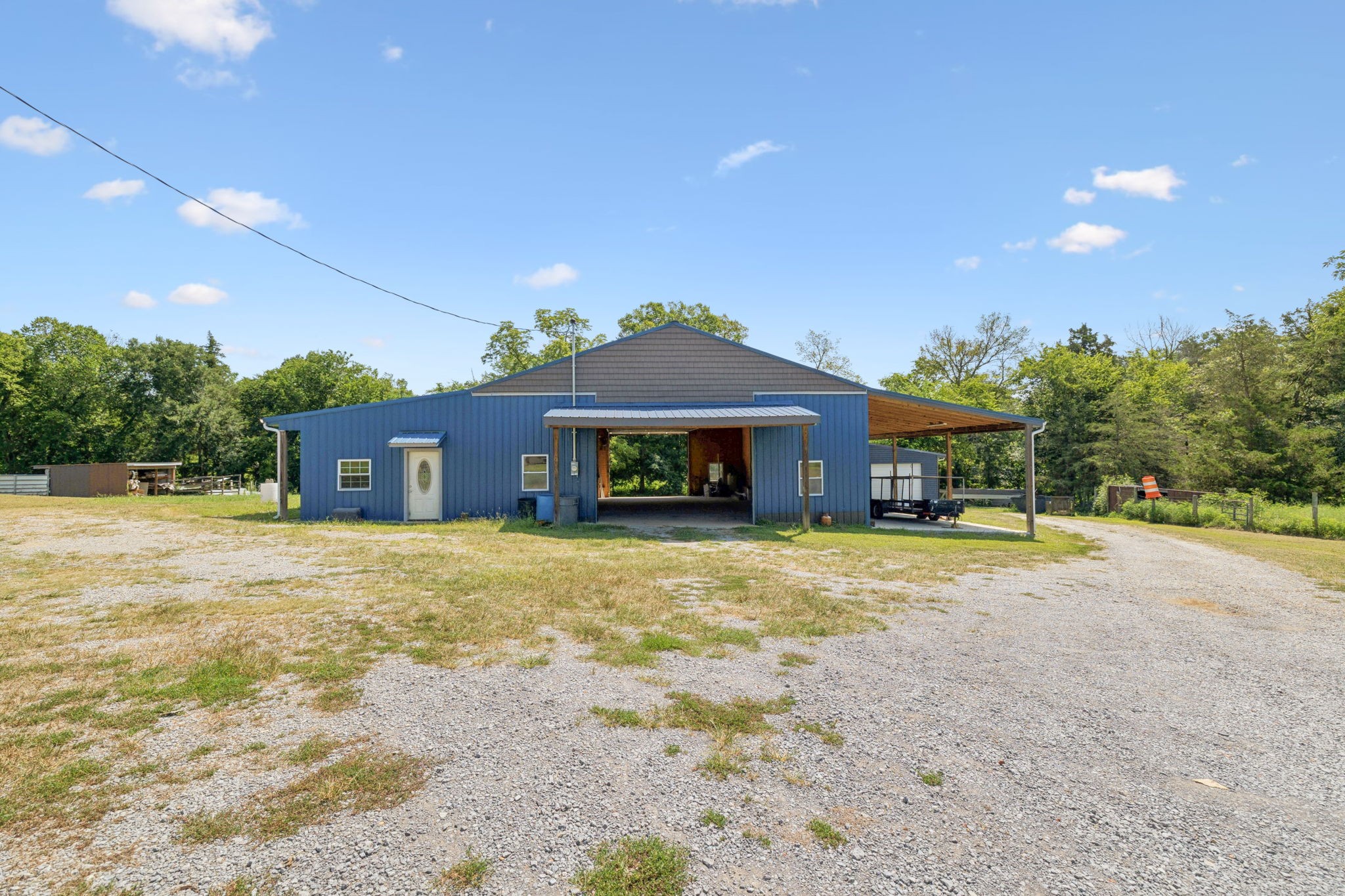 a front view of a house with a yard and a garage
