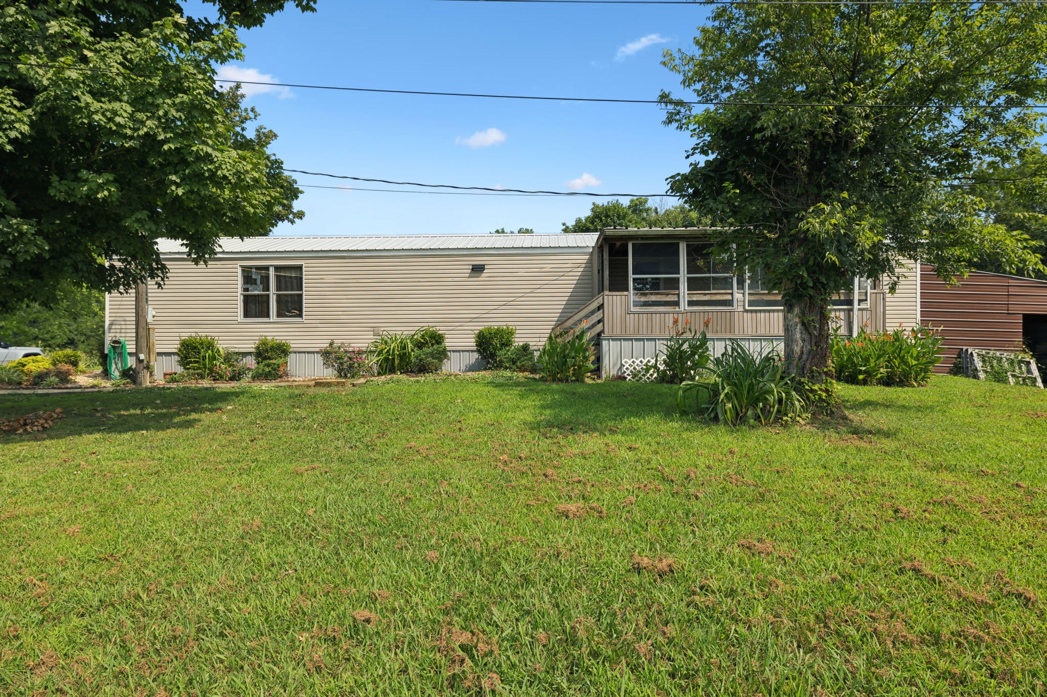 942 Fay Creek Road Wartrace, TN 37183 - Photo 14 of 68 a front view of a house with garden