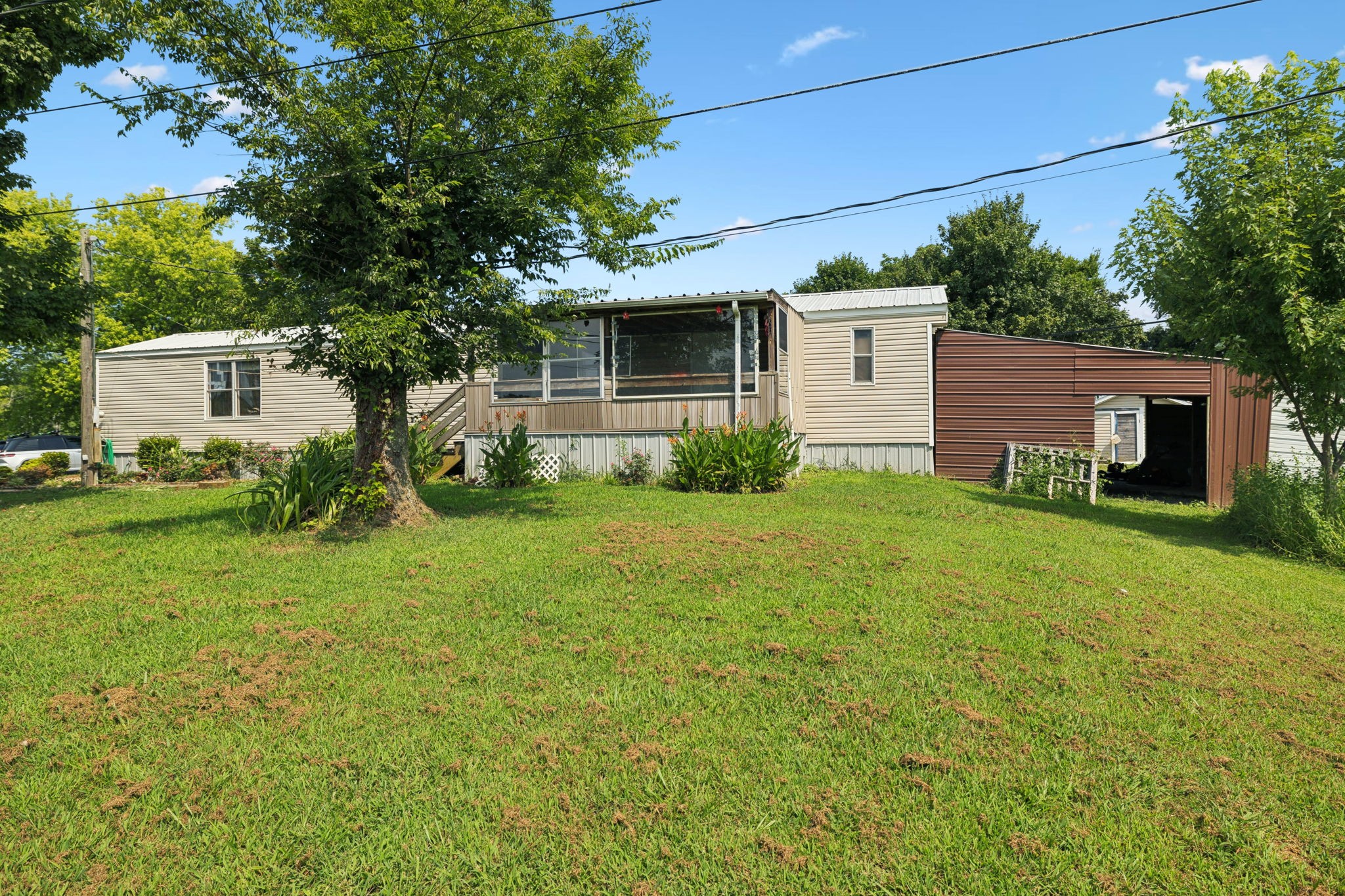 942 Fay Creek Road Wartrace, TN 37183 - Photo 15 of 68 a view of a house with backyard and a tree