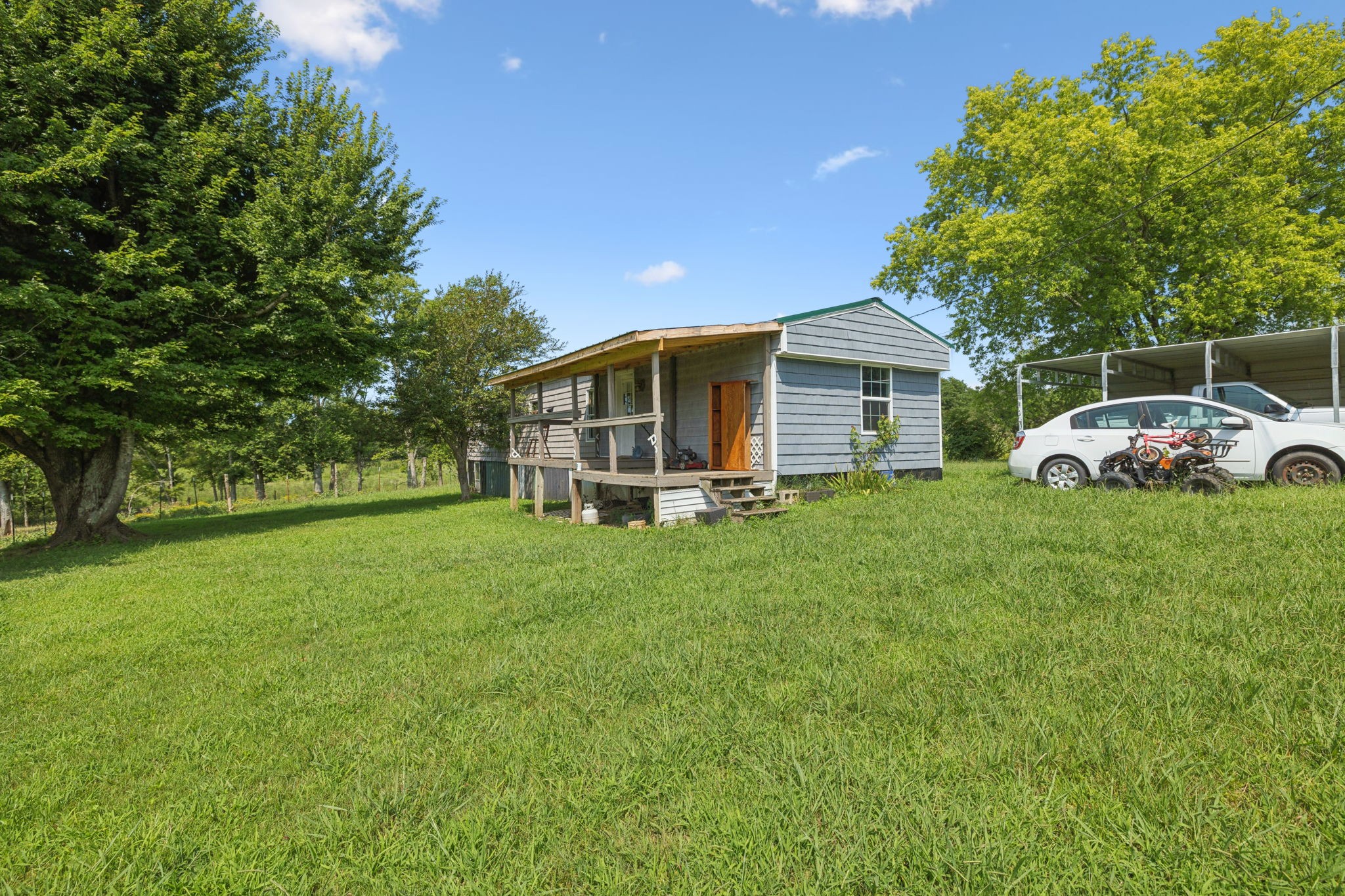 942 Fay Creek Road Wartrace, TN 37183 - Photo 17 of 68 a view of a house with a yard