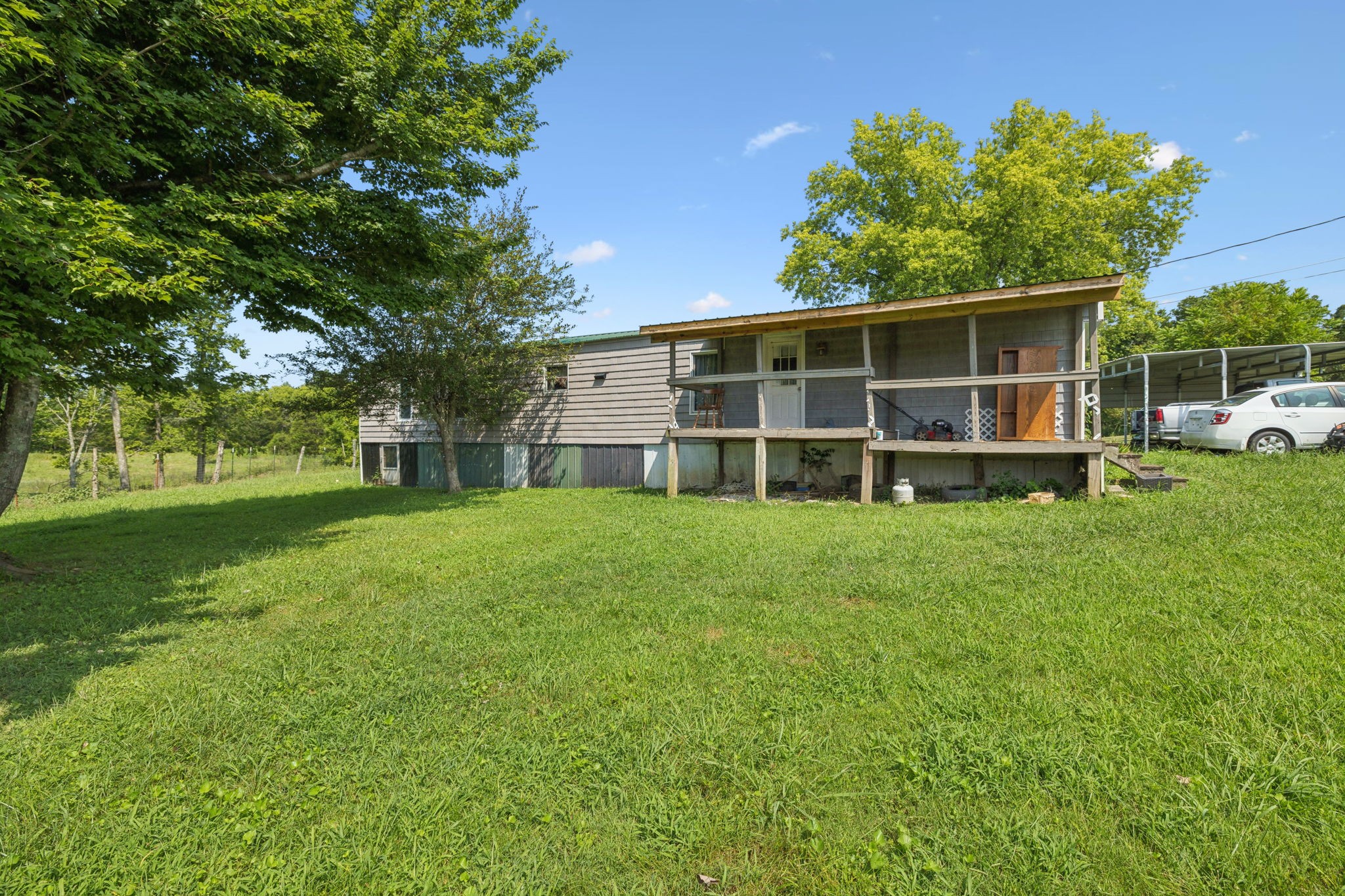 942 Fay Creek Road Wartrace, TN 37183 - Photo 18 of 68 a view of a house with a yard and sitting area