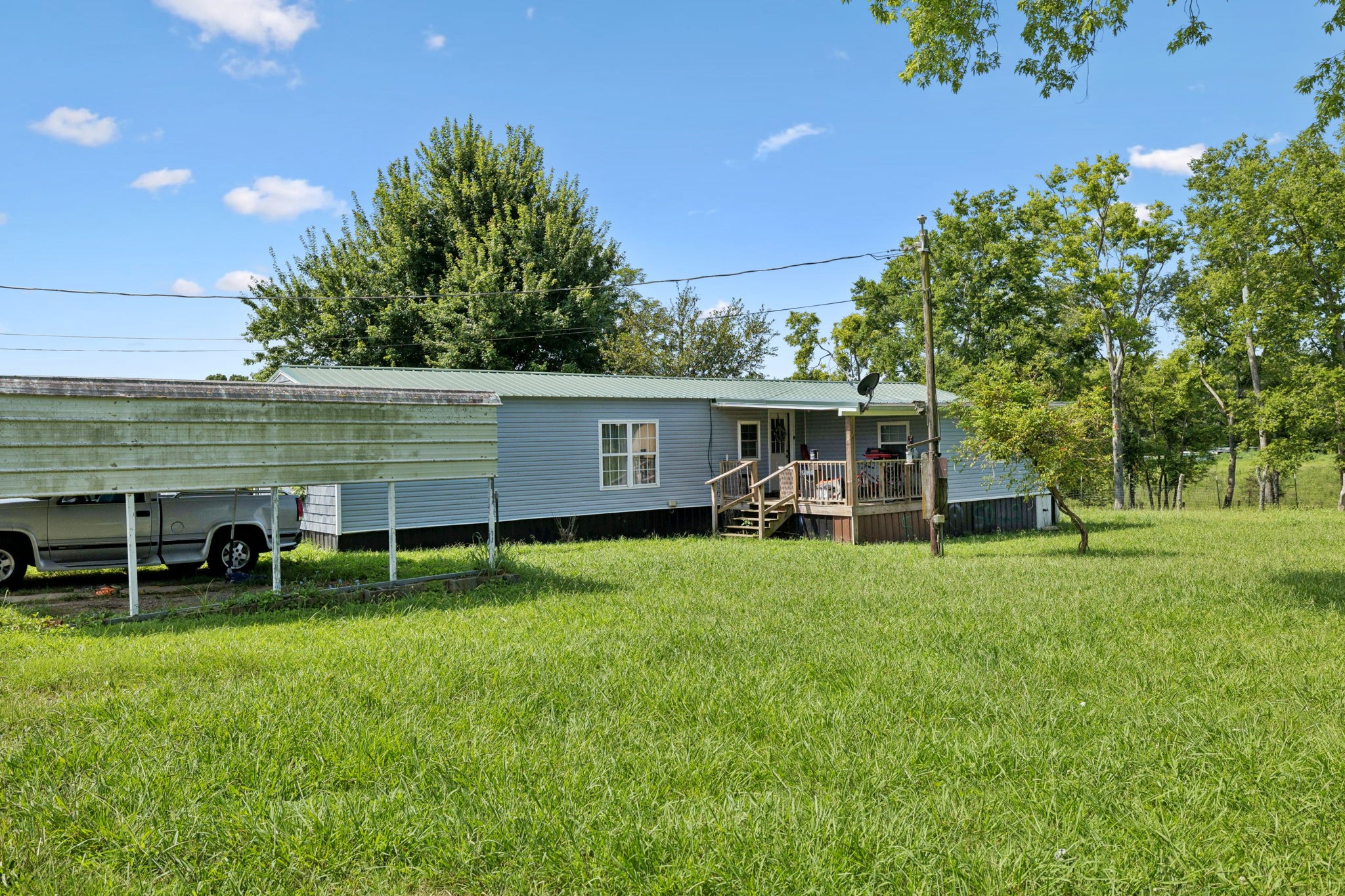 942 Fay Creek Road Wartrace, TN 37183 - Photo 21 of 68 a view of a house with a backyard