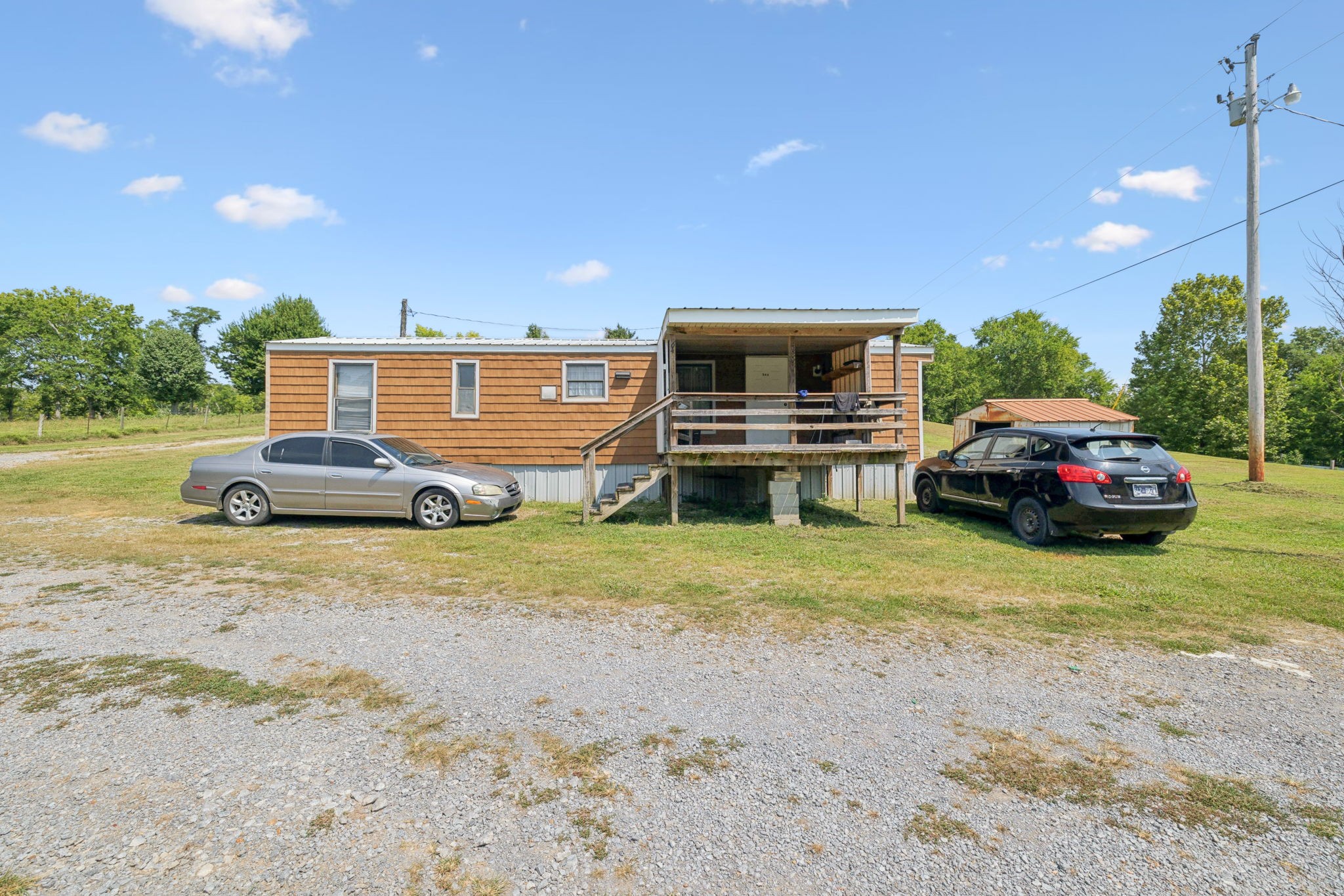 942 Fay Creek Road Wartrace, TN 37183 - Photo 22 of 68 a car parked in front of a house