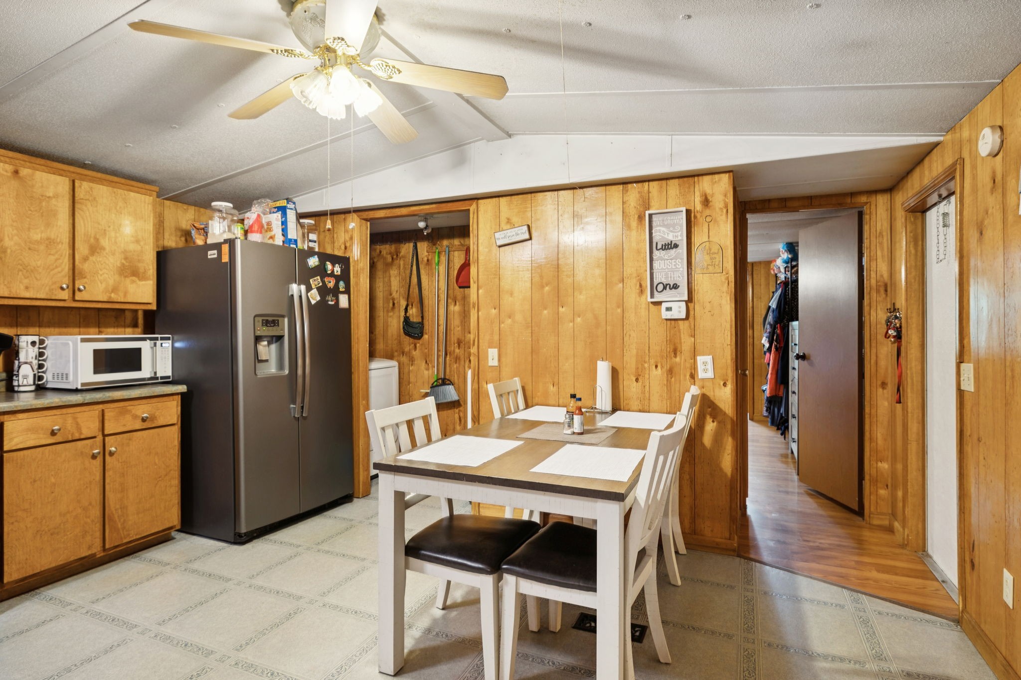 942 Fay Creek Road Wartrace, TN 37183 - Photo 29 of 68 a kitchen with stainless steel appliances granite countertop a refrigerator a oven a sink with a dining table and chairs