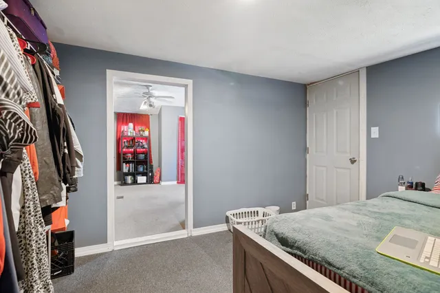 a living room with furniture and a kitchen