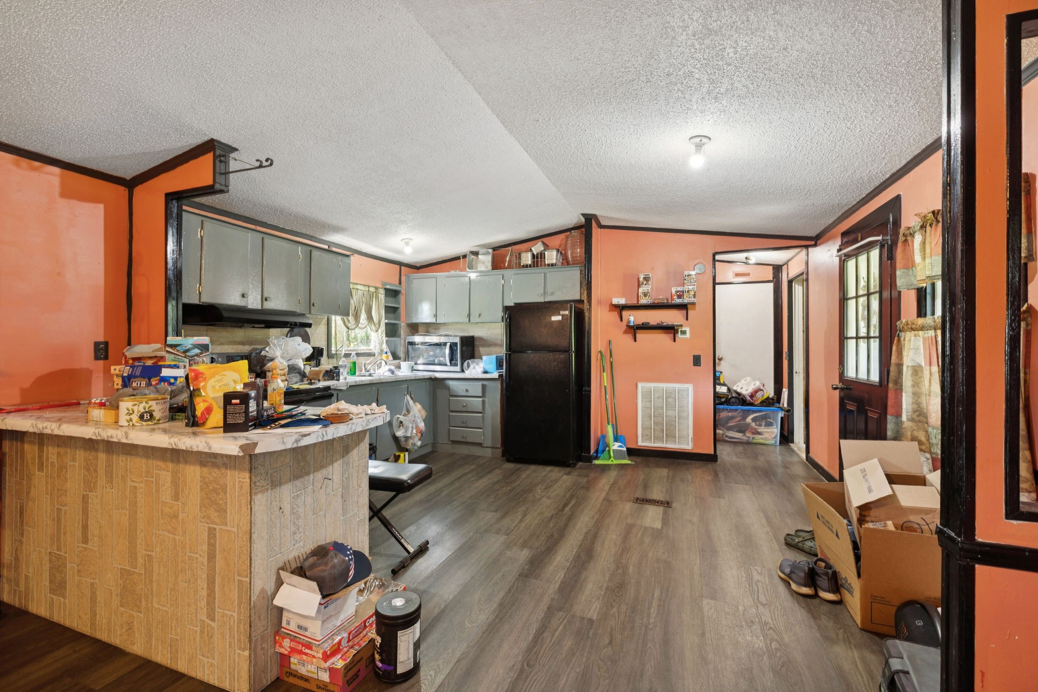 942 Fay Creek Road Wartrace, TN 37183 - Photo 45 of 68 a kitchen with a refrigerator a stove top oven a sink dishwasher and wooden cabinets with wooden floor