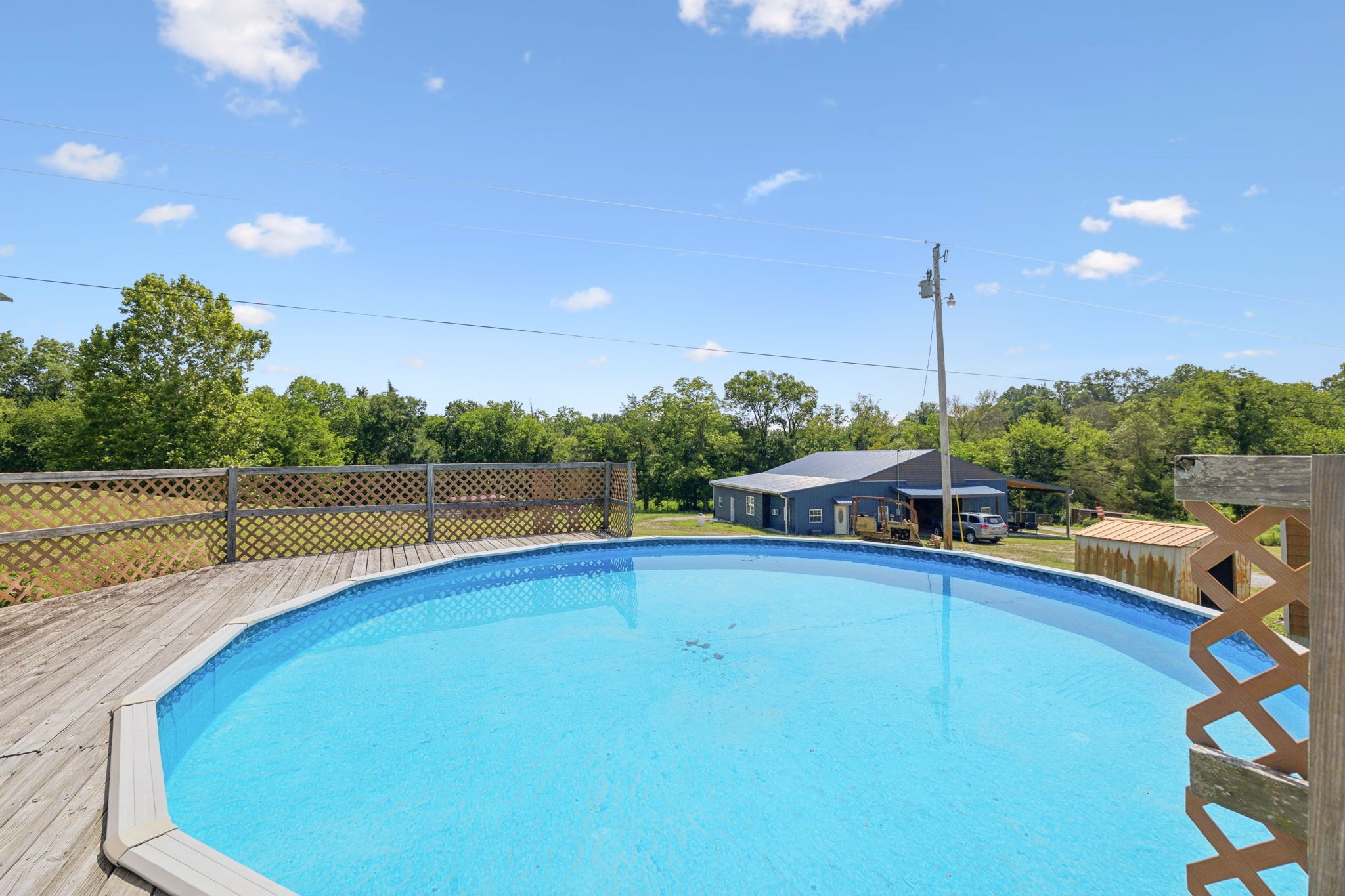 942 Fay Creek Road Wartrace, TN 37183 - Photo 9 of 68 a view of a swimming pool with a patio and a yard