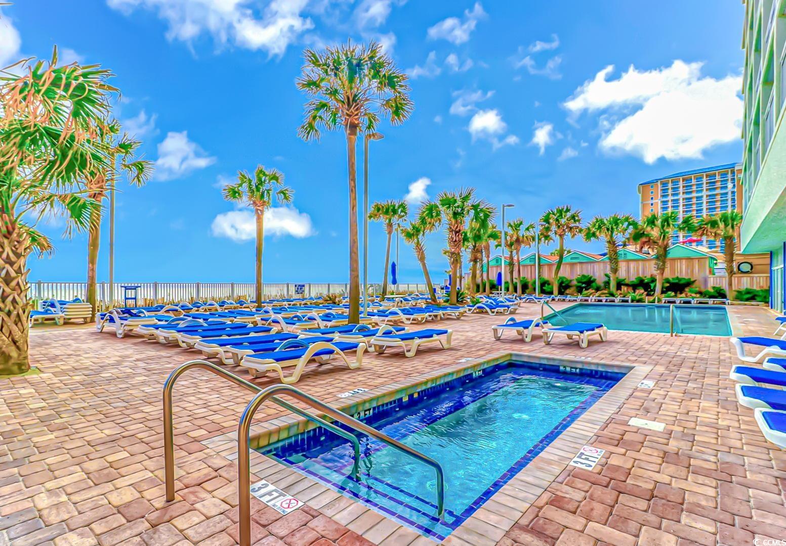 201 South Ocean Boulevard, Unit 1610 Myrtle Beach, SC 29577 - Photo 32 of 40 Community pool with a hot tub and a patio