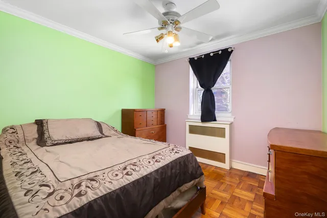 a bedroom with a bed dresser and a window