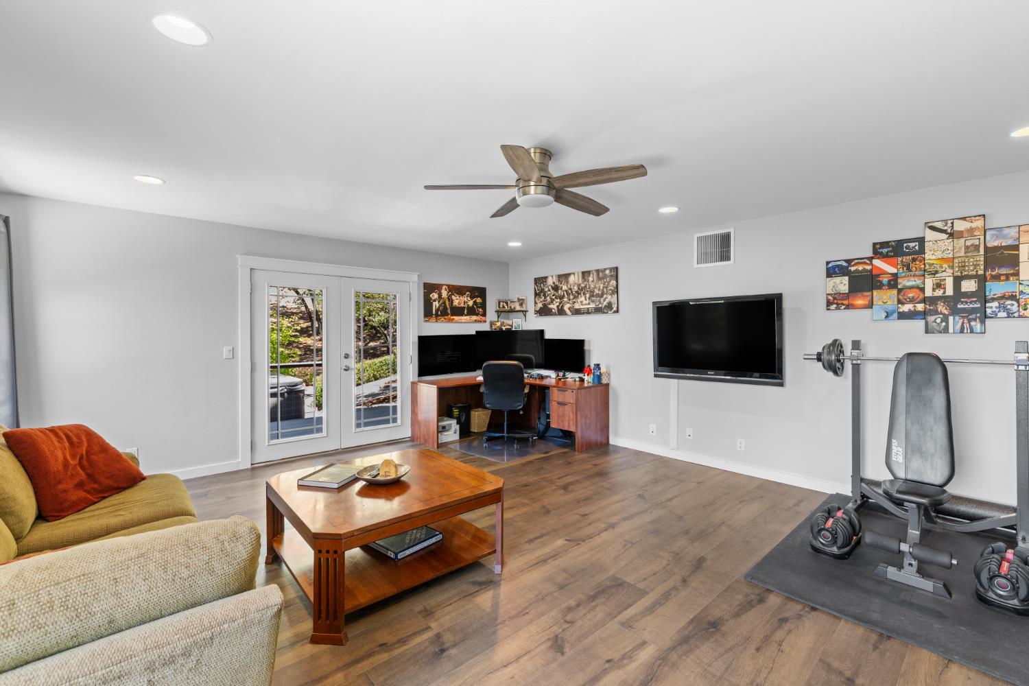 18594 Norlene Way Grass Valley, CA 95949 - Photo 28 of 46 Downstairs, a large family room with its own deck and spa goes into the backyard.