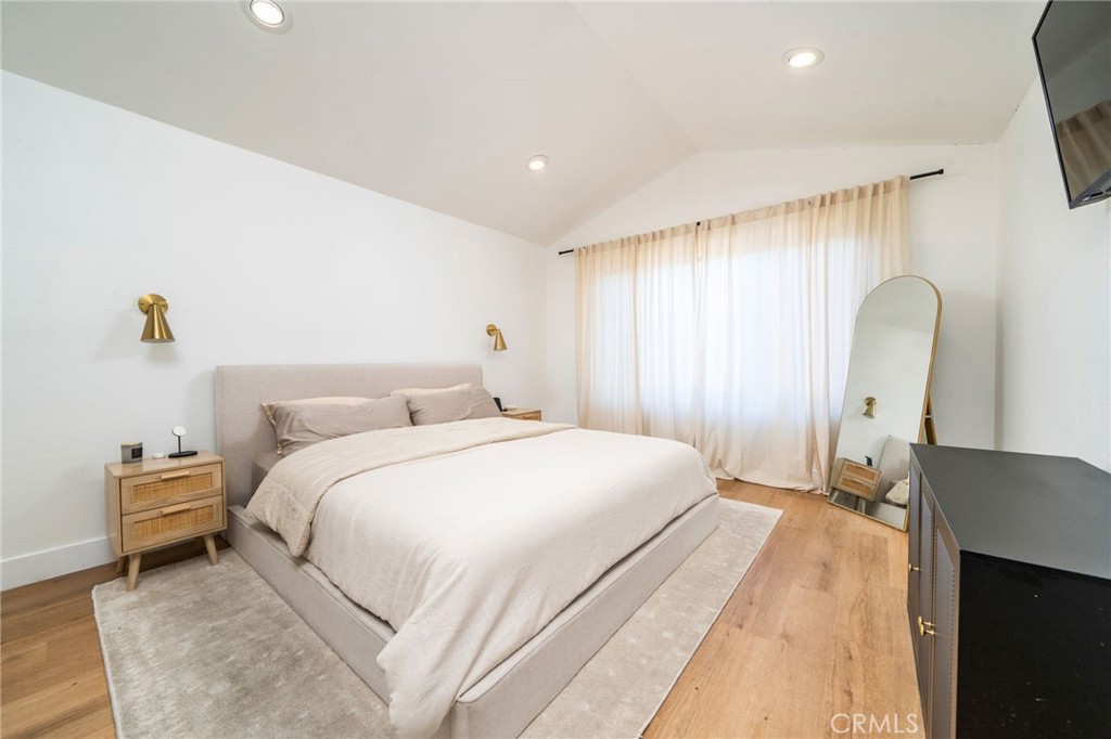 6870 Saddleback Place Rancho Cucamonga, CA 91701 - Photo 12 of 33 a bedroom with a bed and a potted plant